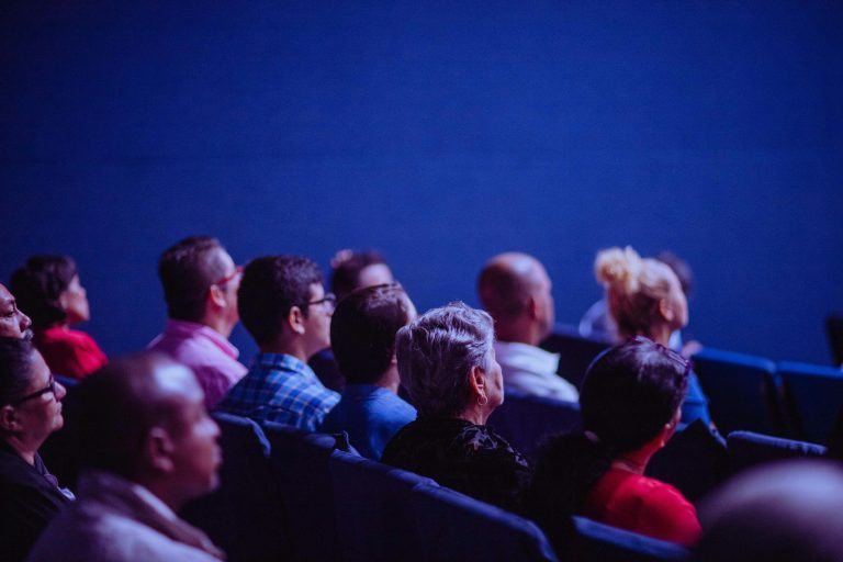 guests seated waiting to learn what event cancellation insurance is
